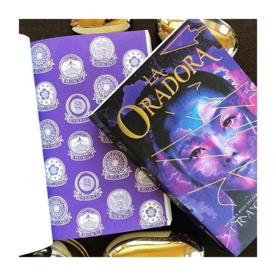 cover of the Spanish edition of The Speaker by Traci Chee, LA ORADORA, with the inside cover of La Oradora, featuring crests from each of the five kingdoms in the book